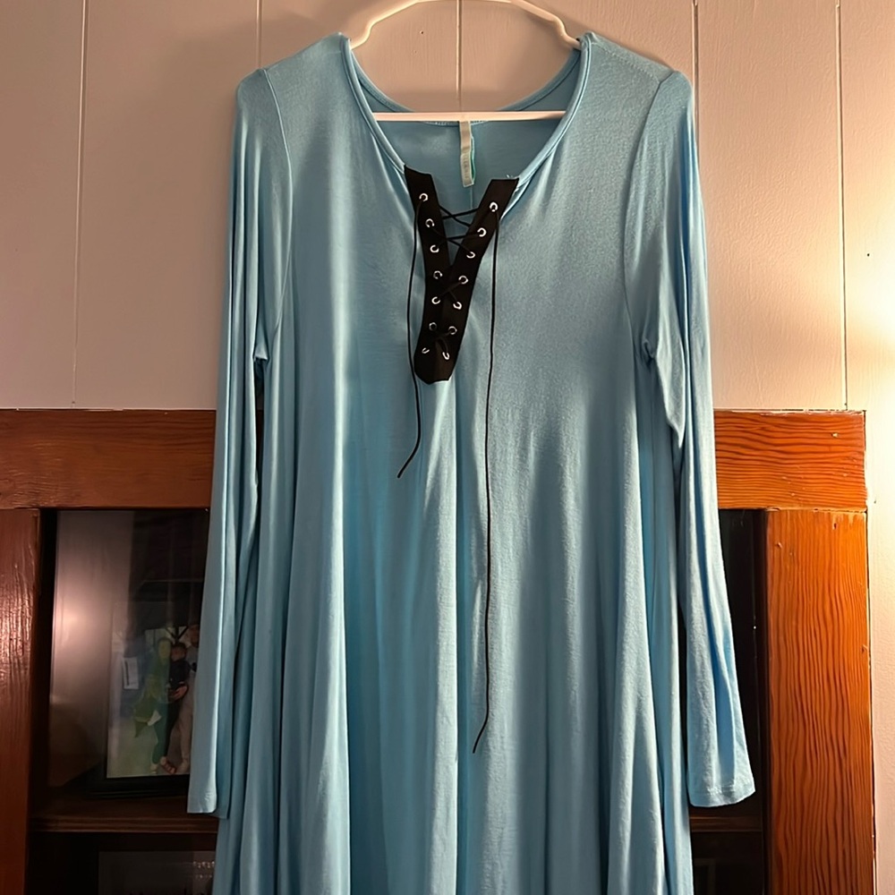 Women dress. Blue in color with black.